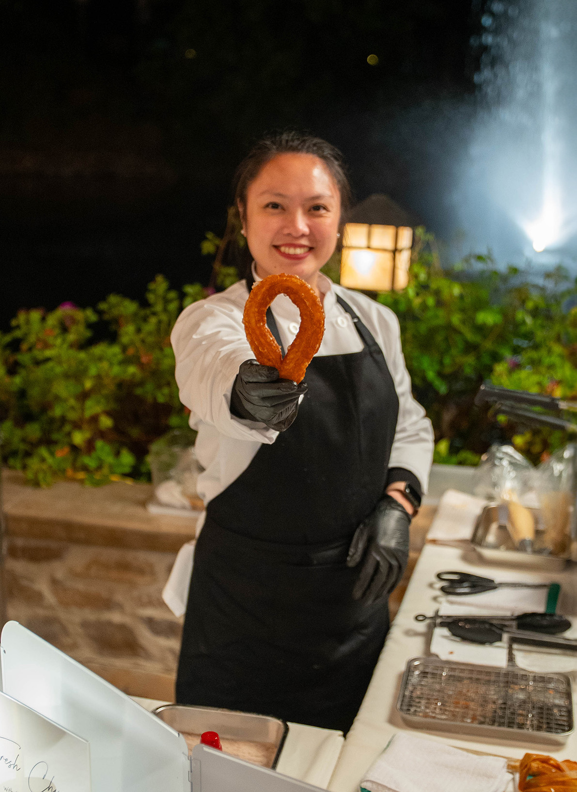 Juries, owner and pastry chef of Buttrcream Cakes, serving fresh churros